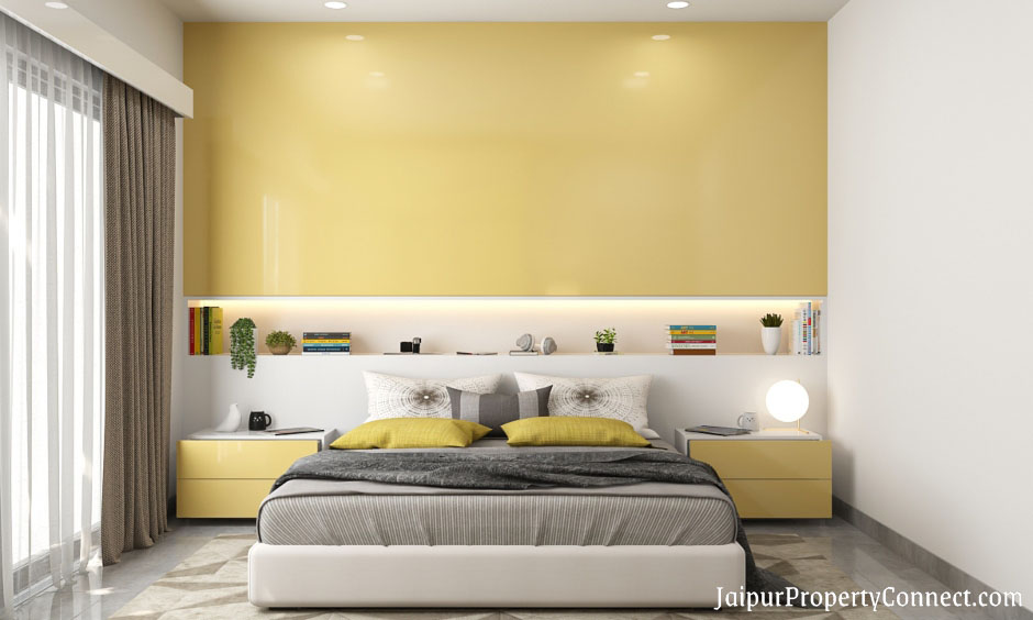 guest-room-is-designed-with-a-sliding-door-wardrobe-finished-in-white-and-yellow-high-gloss-laminate
