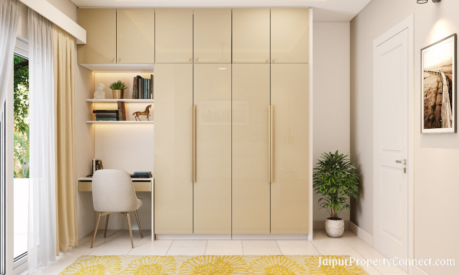 master-bedroom-in-2bhk-designed-with-small-study-table-and-wardrobe